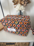 Trousse de toilette fleurie noire et beige