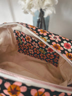 Trousse de toilette fleurie noire et beige